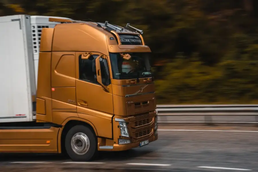 A truck driver heading out at sunrise on the open road
