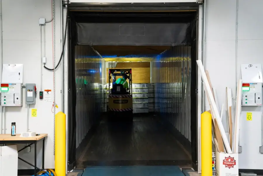 A forklift inside a logistics warehouse