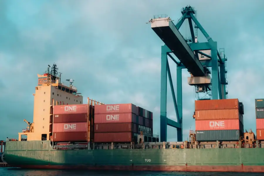 An operations manager reviewing cargo at the port