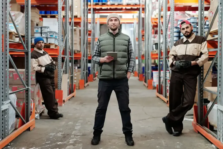 A logistics team working together in a warehouse